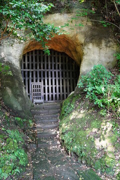 Japanese old rock prison at Kousoku-ji Temple at Kamakura japan. The prison is made in Rocks with wood.