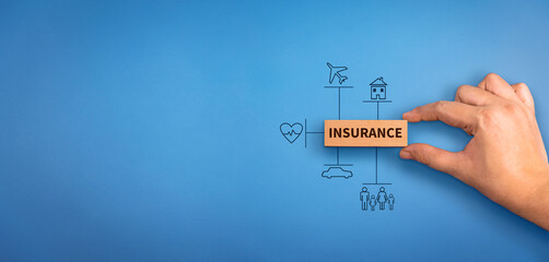 hand holding a wooden block with text insurance, different type of insurance icons. Insurance ...