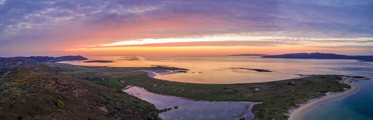 Aerial of sunset above Clooney, Narin and Portnoo in County Donegal - Ireland.