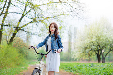 woman  walking with a bicycle