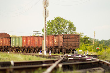 Train cars stand motionless on rails and await departure