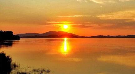 ONE OF THE BEST TOURIST PLACES TO VISIT IN ASSAM,INDIA,A SUNSET VIEW FROM THE BANK OF BRAHMAPUTRA RIVER