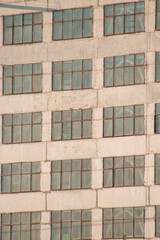 Large blue repeating building windows close-up background