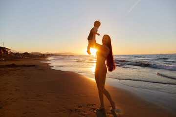 a girl with daughter on the beach