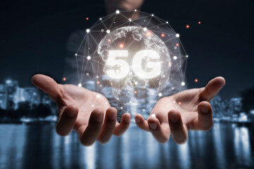 Two hand of businessman holding virtual world with 5G connection. Global communication change and big transformation to internet of things.