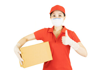 Delivery woman in red uniform isolated on white background.Courier in protective mask and medical gloves holding cardboard box. Receiving package under quarantine, disease outbreak