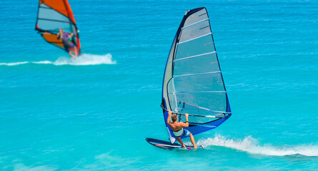 Beautiful cloudy sky with (same) Windsurfer Surfing The Wind On Waves In Alacati - Cesme, Turkey 