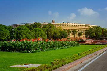Fototapeta na wymiar The Sansad Bhawan or Parliament Building is the house of the Parliament of India, New Delhi. It was designed by the British architect Edwin Lutyens and Herbert Baker in 1912-1913.