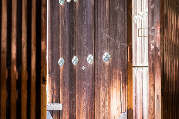 Fototapeta na wymiar Close up of the ornamented, Japanese style, wooden doors