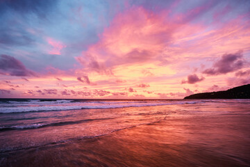 Fototapeta na wymiar Beautiful sunset on ocean beach. Sky is reflecting at water.
