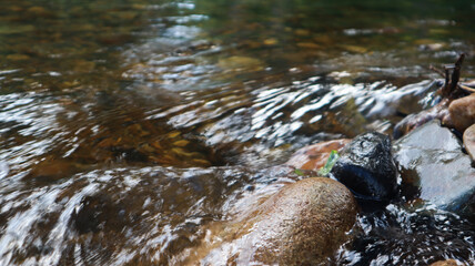 The water flows through the stone crevices.