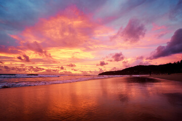 Fototapeta na wymiar Beautiful sunset on ocean beach. Sky is reflecting at water.