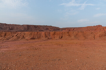Sandy gravel ground surface and earth slope on construction land