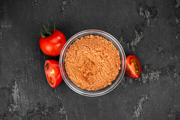 Portion of Tomato Powder (close up; selective focus)