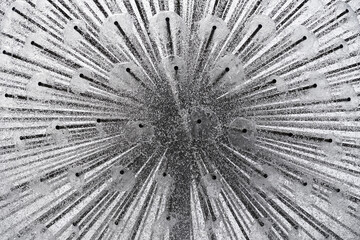Closeup view of fountain with many drops of water. Abstract background. Black and white image.