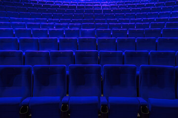 Absolutely empty blue chairs in cinema with nobody