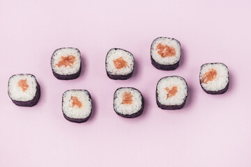 Fresh Made Sushi set with Salmon on Pink Background Japanese Food Sushi Top View Horizontal