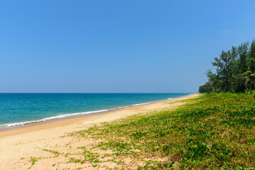 Fototapeta na wymiar Beautiful tropical landscape beach sea and sand with blue sky in Mai Khao Beach,Phuket, Thailand .-Summer Concept