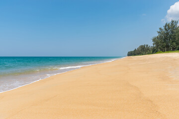 Fototapeta na wymiar Beautiful tropical landscape beach sea and sand with blue sky in Mai Khao Beach,Phuket, Thailand .