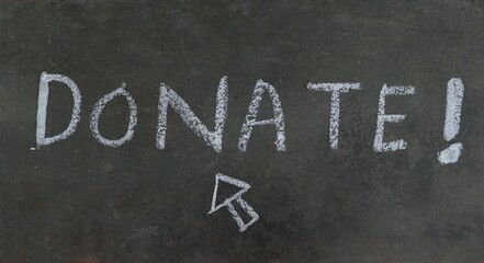 Fototapeta premium Donate Word Written with White Chalk on Black Rough Surface, Donation Conceptual Photo