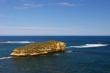 The eroded limestone cliffs on an islet in the Bay of Islands, Victoria, Australia.