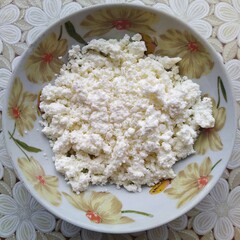 cottage cheese on plate on table with tablecloth