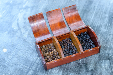 Roasted coffee beans on dark vintage table background. - 355906106