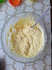 bowl with dough for baking muffins on table