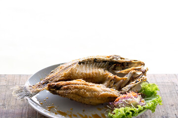 fried fish and seafood sauce on wood table and white background, Thai food. - 355906791
