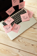 Image of laptop full of sticky notes reminders on screen. Work overload concept image. Coworking or working at home concept image.