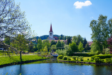 Schonach / Germany - May 17, 2020: Scenic view of the village Schonach in the Black Forest of Germany. It is famous for ski jumping world cups. The catholic church St. Urban in the centre.