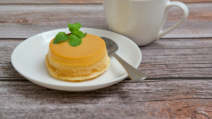 Homemade caramel custard cake, custard chiffon cake on wooden table.