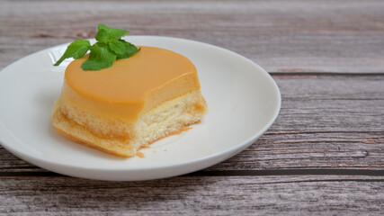 Homemade caramel custard cake, custard chiffon cake on wooden table.