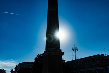silhouette in backlight of Piazza del Popolo square with obelisk in Rome. Italy