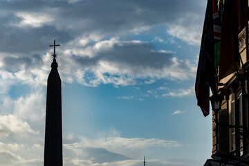 silhouette in backlight of Piazza del Popolo square with obelisk in Rome. Italy