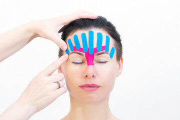 Face taping, close-up of a girls face with cosmetological anti-wrinkle tape. Face aesthetic taping....