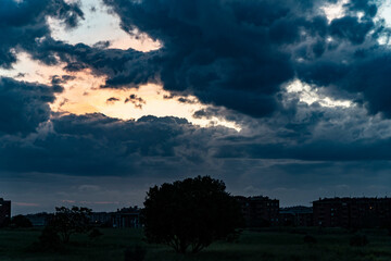 Low threatening storm clouds hanging over on a suburbs of Rome, Italy