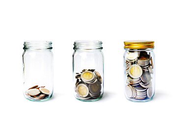 Coin in jar step growing up, Concept save money or investment financial. Three glass bottles close...