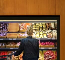 Supermarket shopping, face mask and gloves,Woman buying vegetables at the market	
