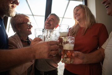 glasses of beer in the hands of best friends .