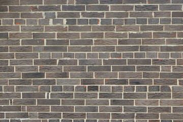 Fototapeta premium Brown background of beautiful unusual building brick