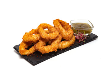 Fries squid rings with sauce on a white background