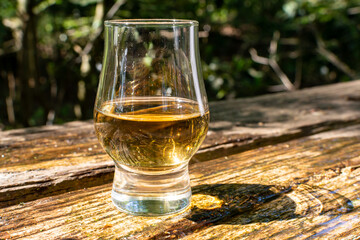 Tasting of different Scotch whiskies on outdoor terrace, dram of whiskey