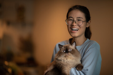 Asian young people stay at home with himalayan cat, pet lover