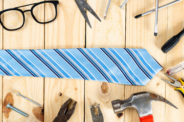 Happy Father Day background concept with tools and tie on wooden background with copy space for text.