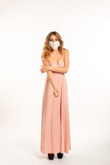 Woman wearing surgical mask on a white background