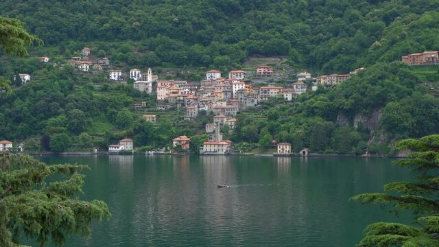 Relaxing atmosphere on lake Como,with the characteristic village of Careno in the background.4K