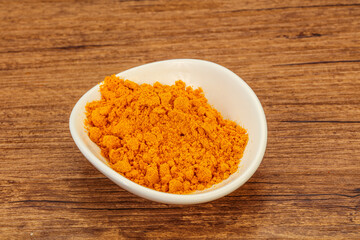 Tumeric powder in the bowl