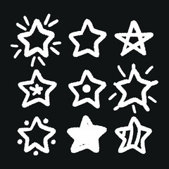 Obraz premium Set of black hand drawn doodle stars in isolated on white background.