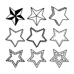 Set of black hand drawn doodle stars in isolated on white background.